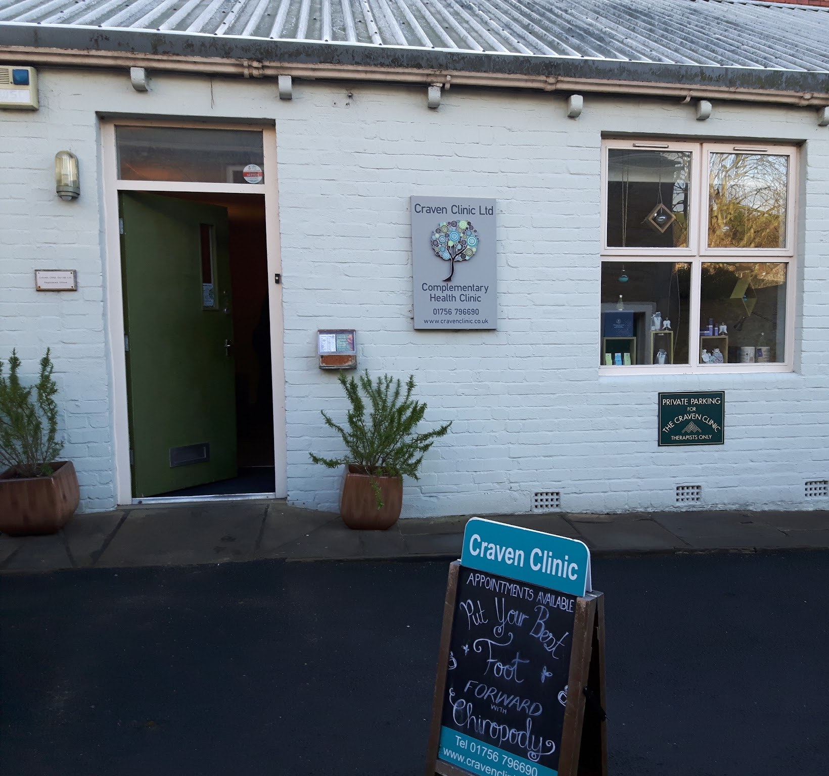 The clinic frontage with its chalkboard sign: Put your best foot forward with chiropody